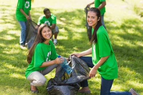 Workers sorting mixed commercial recyclables into separate streams